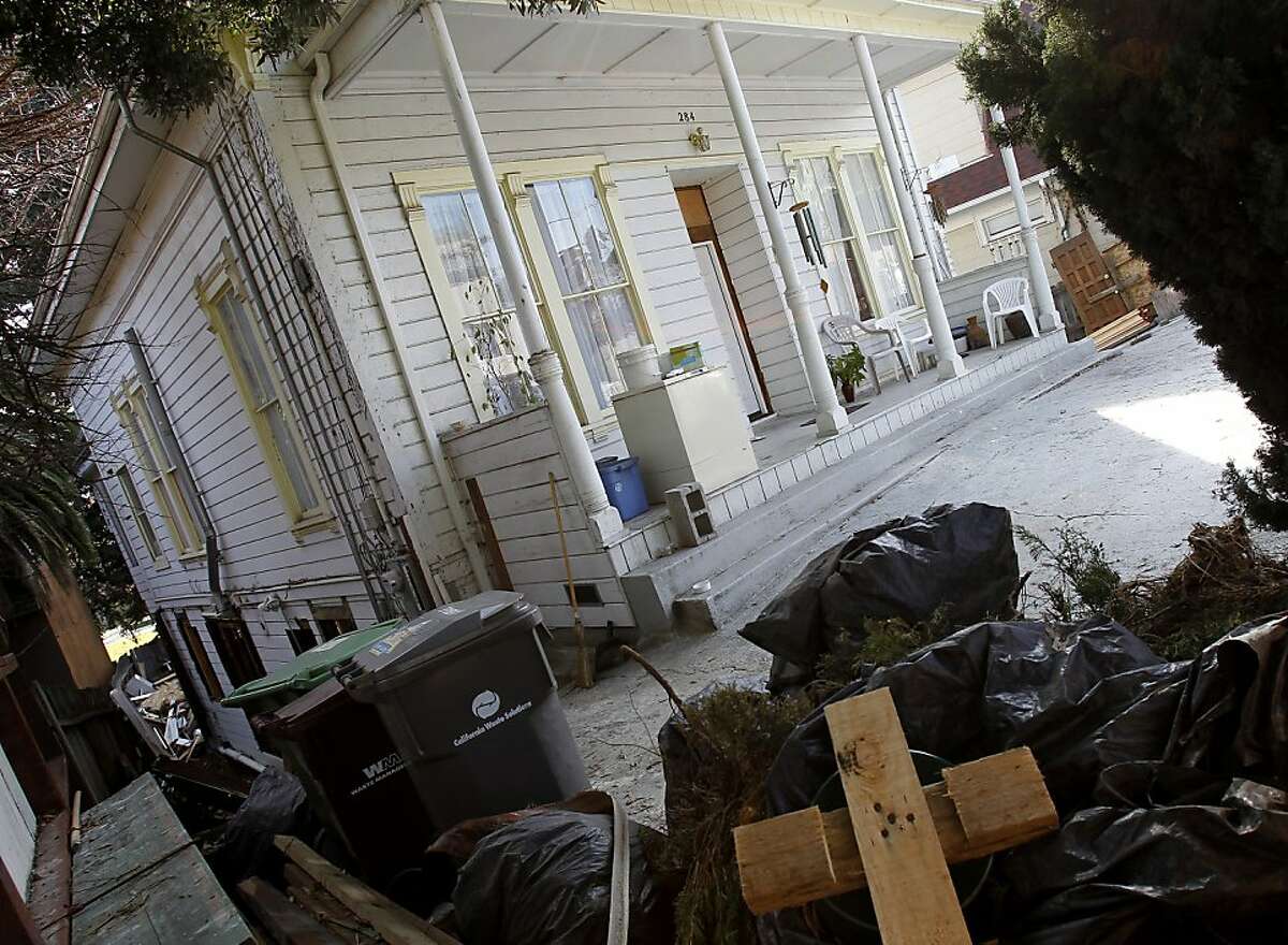 The home was undergoing extensive renovation. Some debris is stacked out in front. Friends and family members returned to the home at 284 Athol Avenue in Oakland, Calif. Sunday January 29, 2012 where two parents were allegedly killed by their son late last week.
