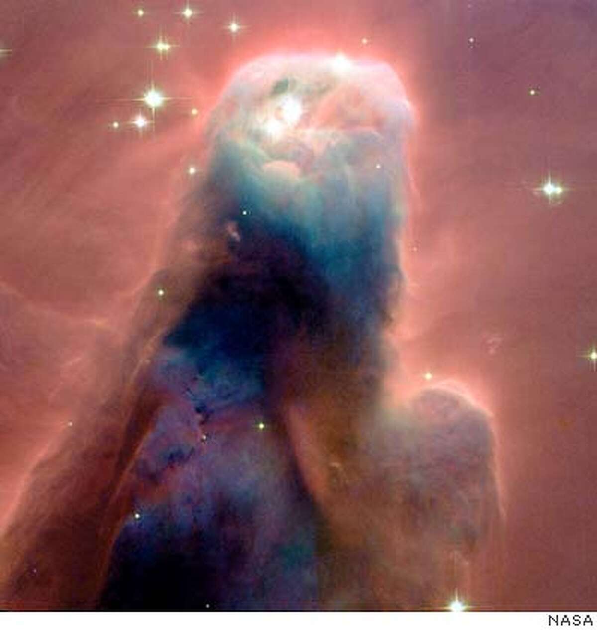THIS IS A HANDOUT IMAGE. PLEASE VERIFY RIGHTS. HUBBLECONE-C-26DEC02-MN-HO The Hubble telescope imaged the "Cone Nebula," a craggy-looking mountaintop of cold gas and dust that is a cousin to Hubble's iconic "pillars of creation" in the Eagle Nebula, photographed in 1995. NASA PHOTO