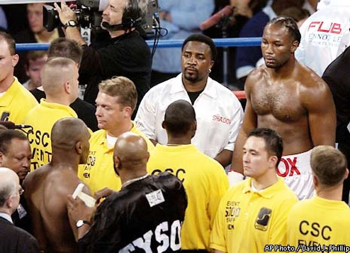 Lewis still king of the ring / Heavyweight champ drops Tyson in 8th