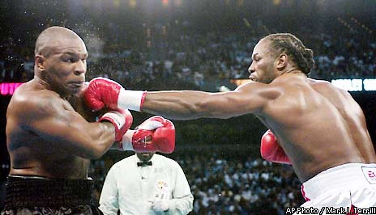 Lewis still king of the ring / Heavyweight champ drops Tyson in 8th