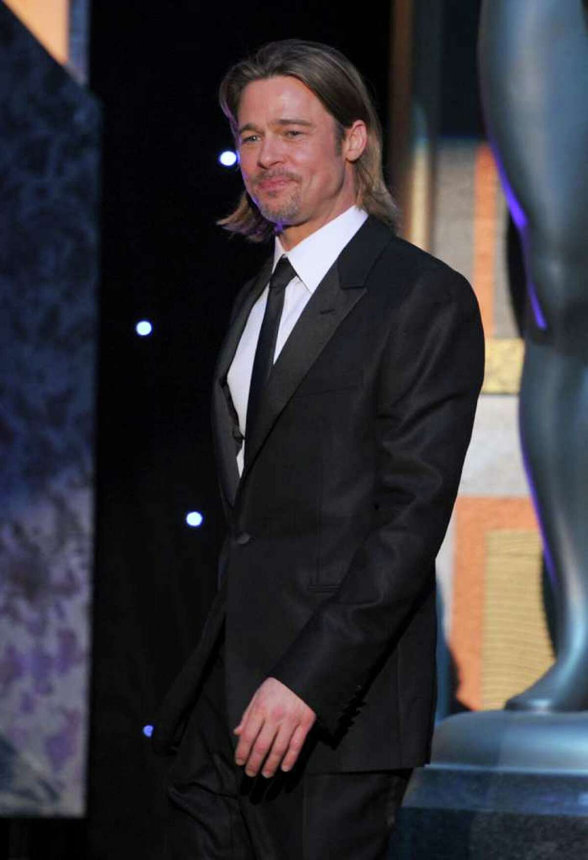 LOS ANGELES, CA - JANUARY 29: Actor Brad Pitt speaks onstage during the 18th Annual Screen Actors Guild Awards at The Shrine Auditorium on January 29, 2012 in Los Angeles, California. (Photo by Kevin Winter/Getty Images)