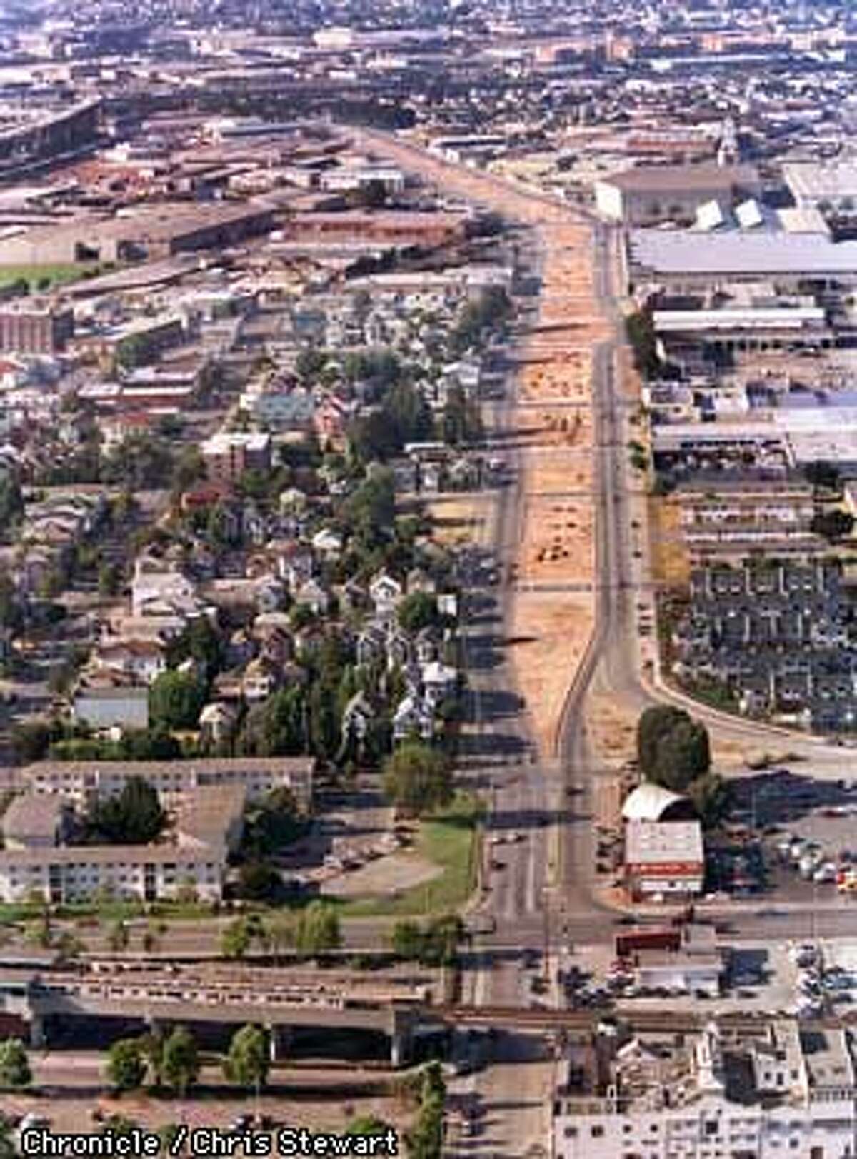 Long after the Cypress freeway structure in West Oakland was torn down following its destruction in the 1989 Loma Prieta earthquake, the ground level Mandela Parkway which replaced the Cypress remains a brown scar of unlandscaped dirt. A major portion of the rebuilt Cypress freeway should open within a month. SAN FRANCISCO CHRONICLE PHOTO BY CHRIS STEWART