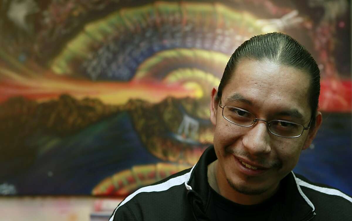 Chief Leonard Alden Crow Dog Jr from the Lakota tribe of North Dakota stands in front of one of his commissioned paintings in his Oakland, Calif., studio Wednesday, January 25, 2012.