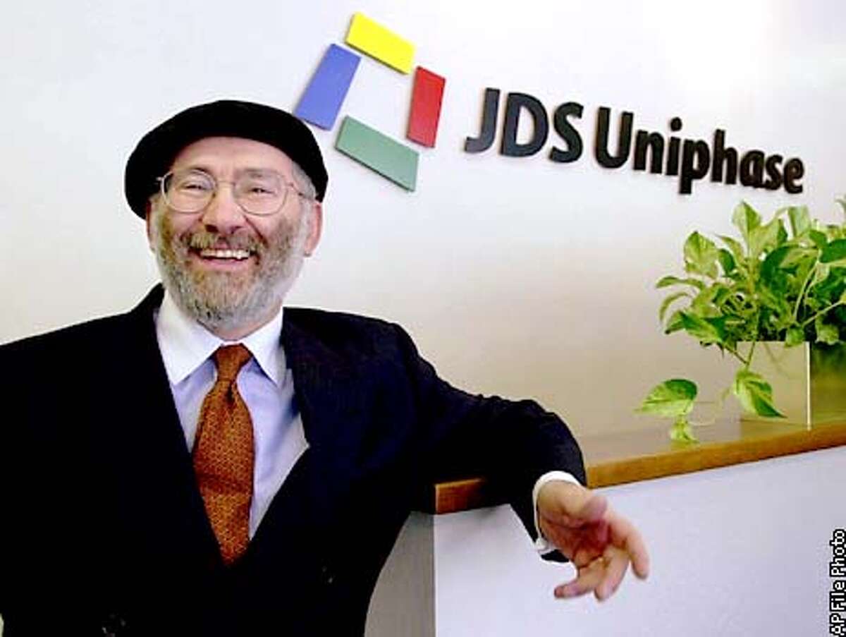 FILE- JDS Uniphase Corp. CEO Jozef Straus smiles at company headquarters in San Jose, Calif., Monday, July 10, 2000. Fiber-optics company JDS Uniphase said Tuesday, Feb. 6, 2001, that it has received approval from the U.S. Justice Department for its $18 billion acquisition of rival SDL Inc.. Both companies manufacture products needed for high-capacity fiber-optic networks. (AP Photo/Paul Sakuma) ALSO RAN: 04/25/2001