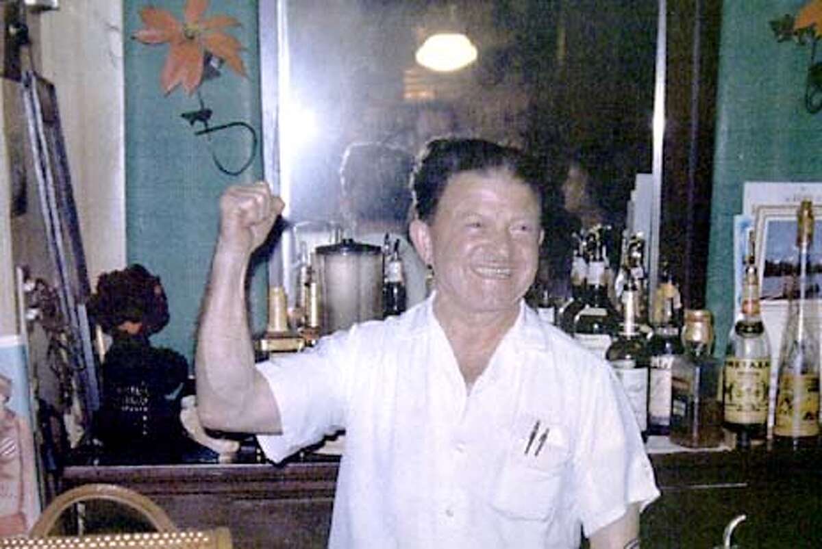 SALOON-C-12DEC01-MT-JRS-The bar Smiley's in the town of Bolinas which is celebrating it's 150th year in operation. Copy shot of Smiley Bianchini in the bar in 1960. Chronicle photo by John Storey.