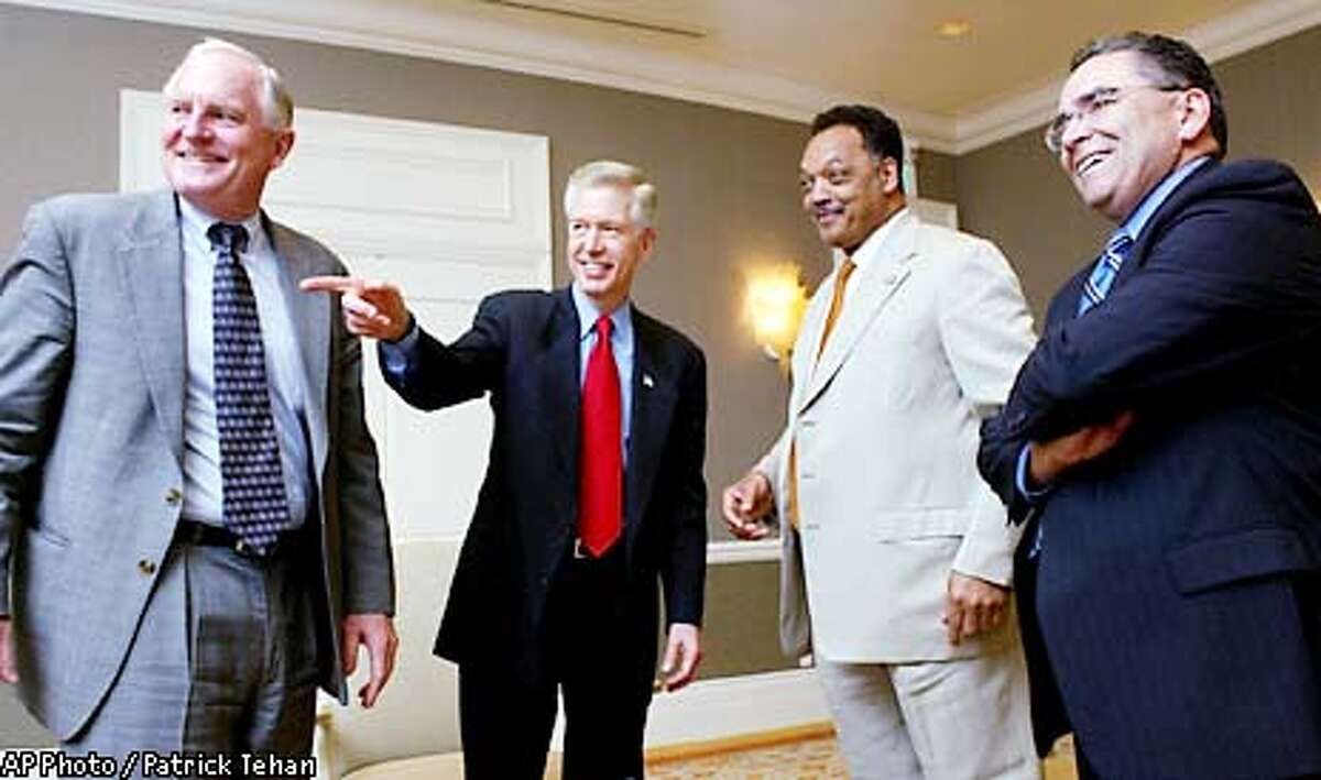 Craig Barrett, CEO of Intel, left, California Governor Gray Davis, the Rev. Jesse Jackson, and San Jose Mayor Ron Gonzales share a laugh prior to a luncheon at the Fairmont Hotel in downtown San Jose, Calif. Wednesday afternoon, April 24, 2002. The luncheon was part of "Governor's California Roundtable: Small Business Opportunities in the New Economy" (AP Photo/San Jose Mercury News, Patrick Tehan)