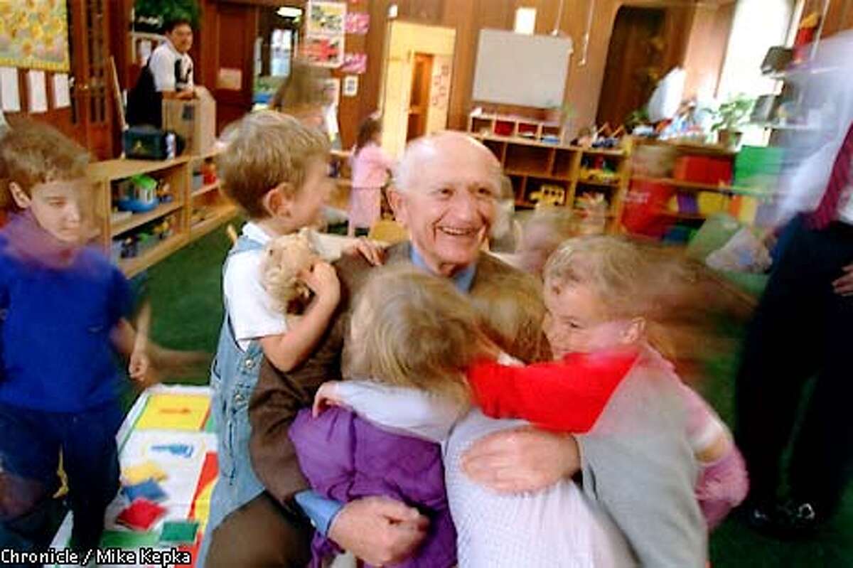 Claude Rosenberg is well received by a group of 3-year-olds who are in the day care program at The Rosenberg Early Childhood Center of JCCSF. BY MIKE KEPKA/THE CHRONICLE