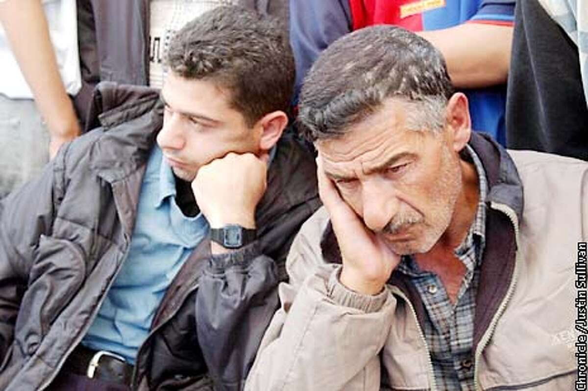 Omar Abu Selima, right, mourns the death of his fifteen year old son Ahmad Omar on Friday April 19, 2002 in Gaza City. Omar was shot and killed by Israeli soldiers on Thursday when he tried to enter the Jewish settlement of Dugit in Gaza. Photo By Justin Sullivan/For The Chronicle