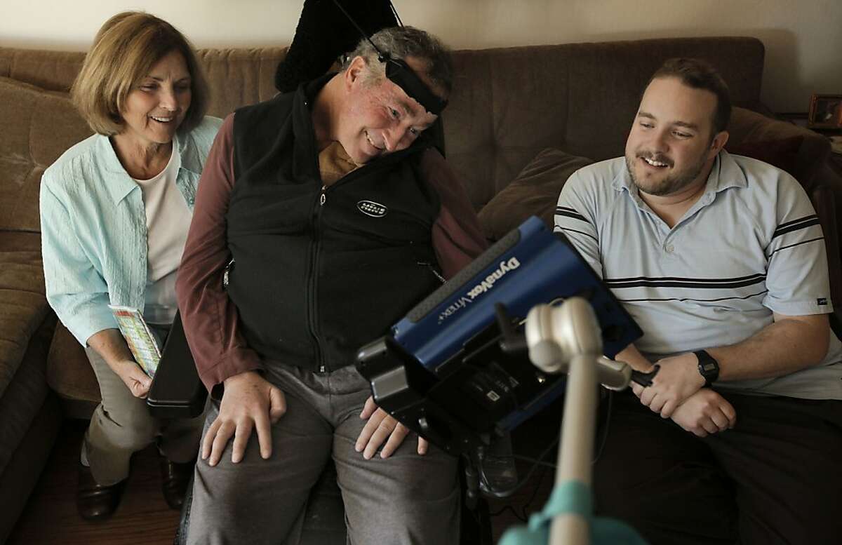 Paul Olney, (wife), Dr. Richard Olney, (center) and his medical-student son, Nick, share a laugh at their Corte Madera, Ca., home on Thursday Apr. 7, 2011. Dr. Richard Olney, a neurologist who founded a clinic for ALS patients at UCSF only to fall prey to the same disease he treated, is racing to finish what may be his last research paper. The study attempts to use early clinical tests to predict which ALS patients will last only a few months and which will last several years.