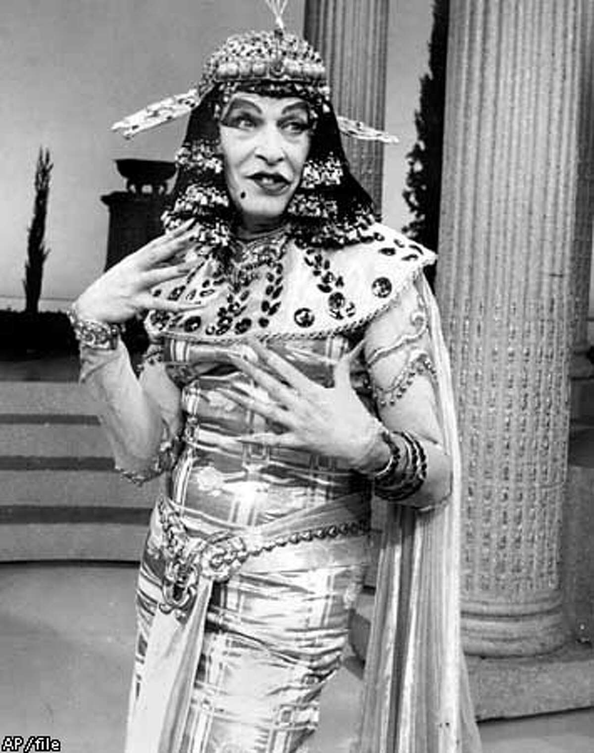 Comedian Milton Berle is the siren of the Nile during "The Milton Berle Show" on Feb. 6, 1962. Berle, the acerbic, cigar-smoking vaudevillian who eagerly embraced a new medium and became ``Mr. Television'' in the dawn of the video age, died Wednesday, March 27, 2002, a spokesman said. He was 93. Berle died at 2:45 p.m. at his home after a lengthy illness, publicist Warren Cowan said. Berle's wife, Lorna, and several family members were at his side. (AP Photo)