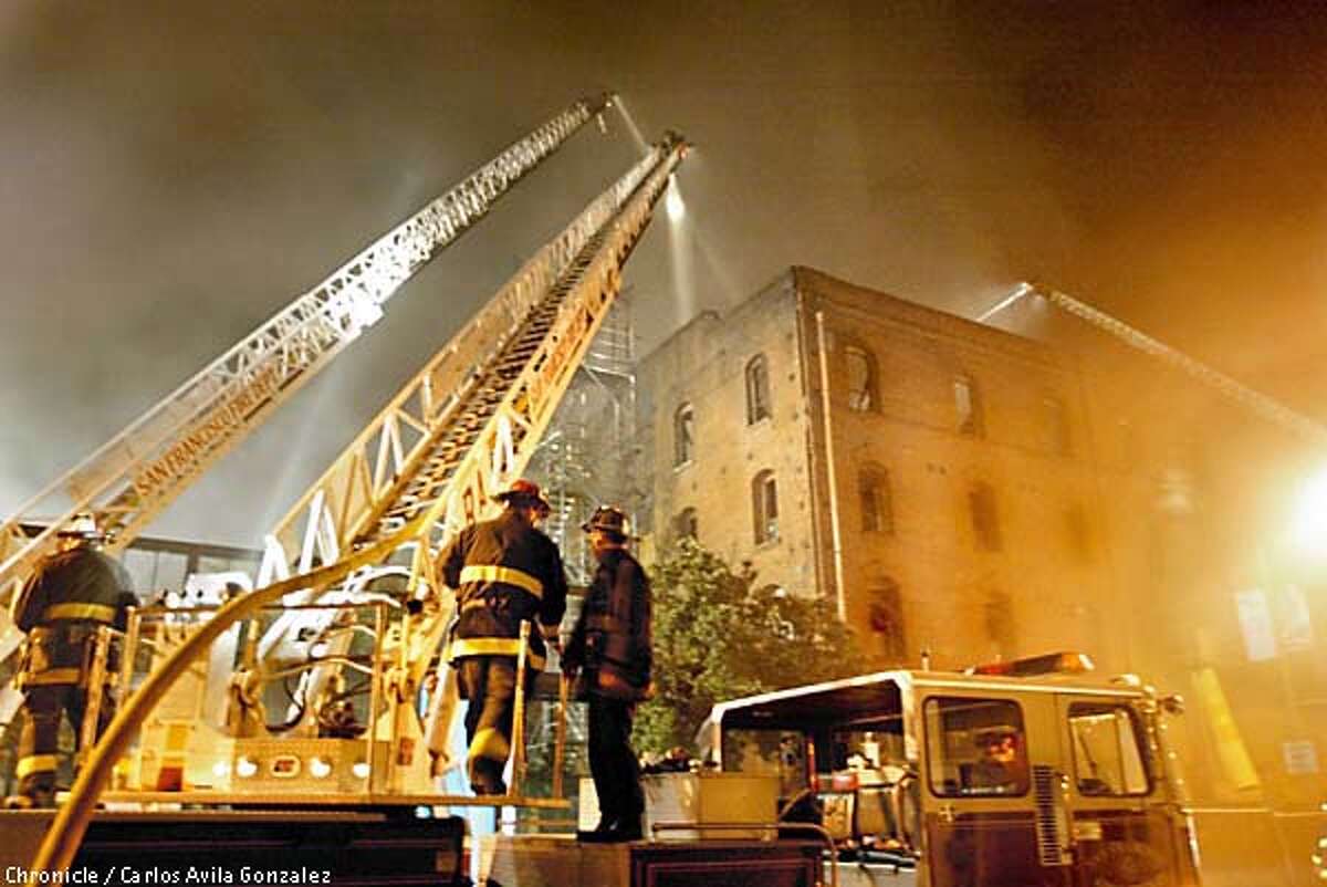 San Francisco firefighters battle a blaze at The Cannery, a historical landmark on San Francisco's Fisherman's Wharf, Sunday March 17, 2002. The fourth floor and roof of the building were completely destroyed, although the brick facade still stands, Capt. Pete Howes said. The building was built around 1907 and was undergoing renovations. San Francisco Chronicle, Carlos Avila Gonzalez)