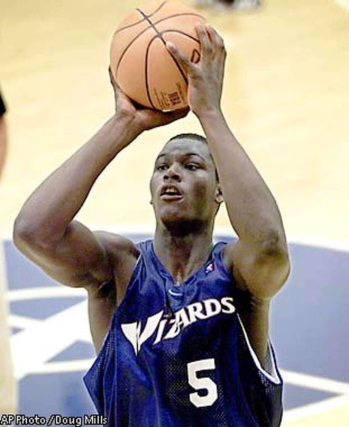 FILE - Washington Wizards first-round draft pick Kwame Brown practices at the MCI Center in Washington in this July 13, 2001 file photo. Although he's the first high school player ever chosen No. 1 overall in the NBA draft, Brown is still a country boy at heart trying to adjust to life with the Washington Wizards. (AP Photo/Doug Mills/File)