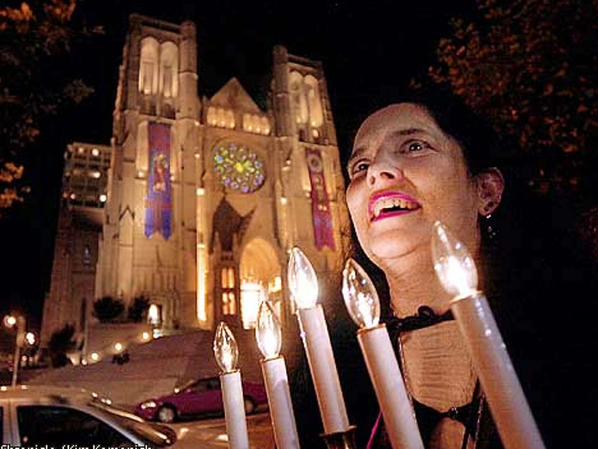 Vampire tour guide with candelabra leading gothic walking tour San Francisco