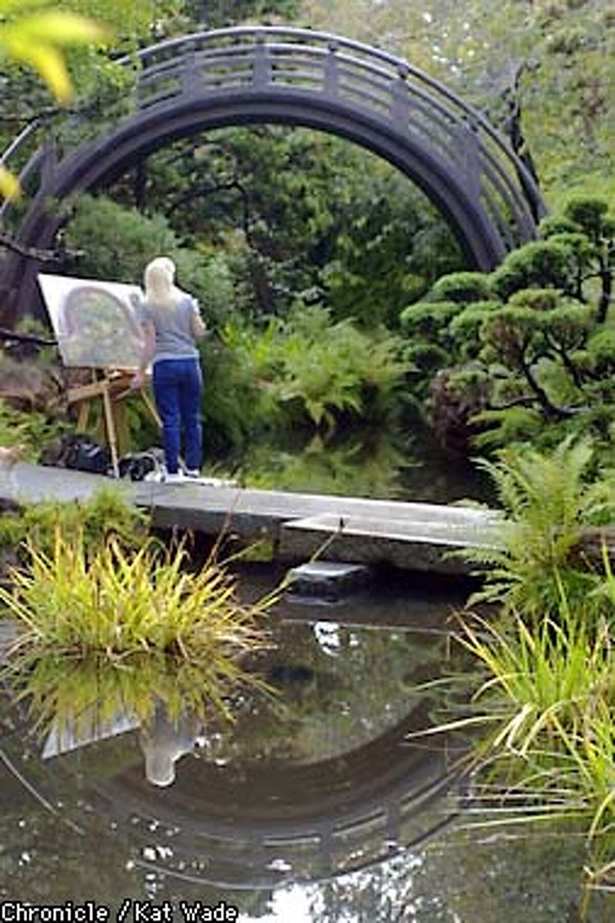 Artist Bonnie Christy, paints her rendition of the Drum Bridge that leads from the main pond towards the tea house at the Japanese Tea Garden in Golden Gate Park, San Francisco. SAN FRANCISCO CHRONICLE PHOTO BY KAT WADE