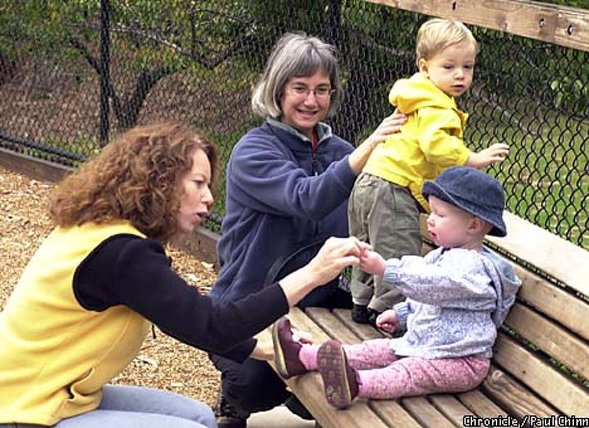 Maureen Sullivan, with daughter Delaney (front), and Valerie Gilbert, with son Stanley, decided not to return to the workforce giving birth. PAUL CHINN/S.F. CHRONICLE