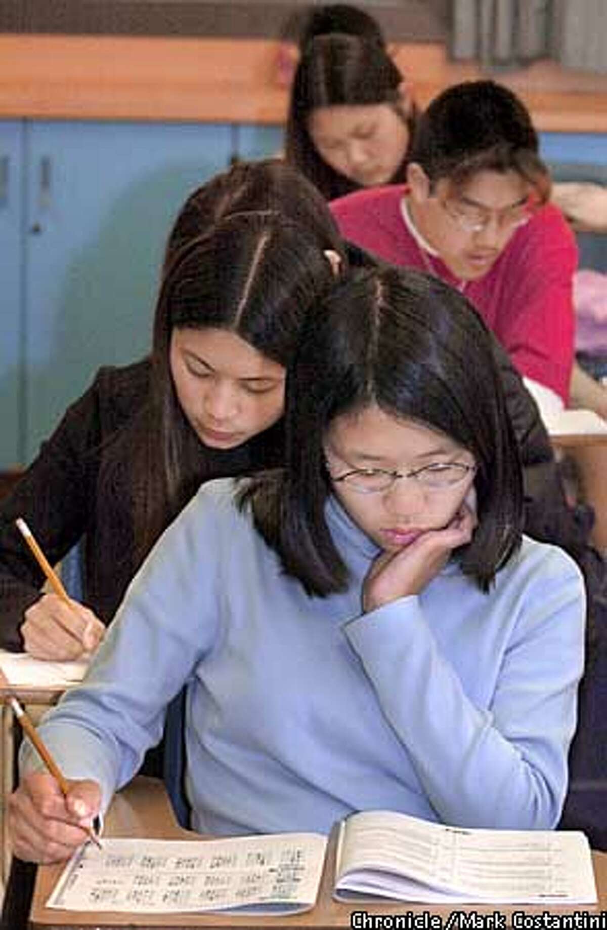 In this file photo, Johanna Lee(front) and other students at Alameda High School in Alameda take standardized tests.