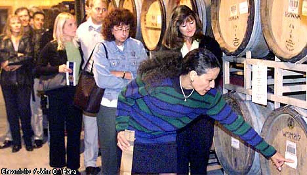 Merryvale Winery 1000 Main st. St. Helena,CA "SANDRA BARROS", Wine Educator and retail sales, gives a tour/seminar every Sunday. In the storage area, Sandra talks about how a barrel is constructed, and how long it lasts. Photo/John O'Hara