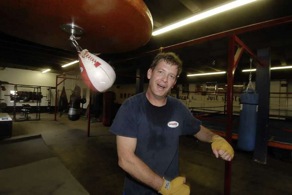 Episcopal minister Rev. Patrick Miller punches the speed bag during his morning work outs at Main Boxing Gym Thursday 12/08/11. Photo by Tony Bullard.