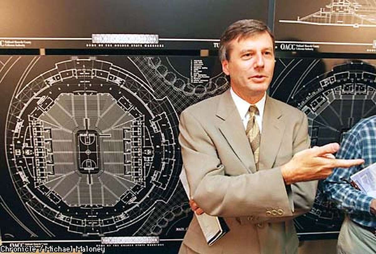COLISEUM/C/10JUN96/SP/MJM Warriors owner Chris Cohan answers questions from the media in front of an architect's layout of the interior seating in the new Oakland Arena. The Warriors and Oakland-Alameda County Stadium Authority announced today at a press conference that they chose the design/build team of Tutor-Saliba Corporation and HNTB Corporation to construct the new state-of-the-art arena at the Coliseum Complex. ALSO RAN: 6/11/96, 12/21/98 Photo by Michael Maloney