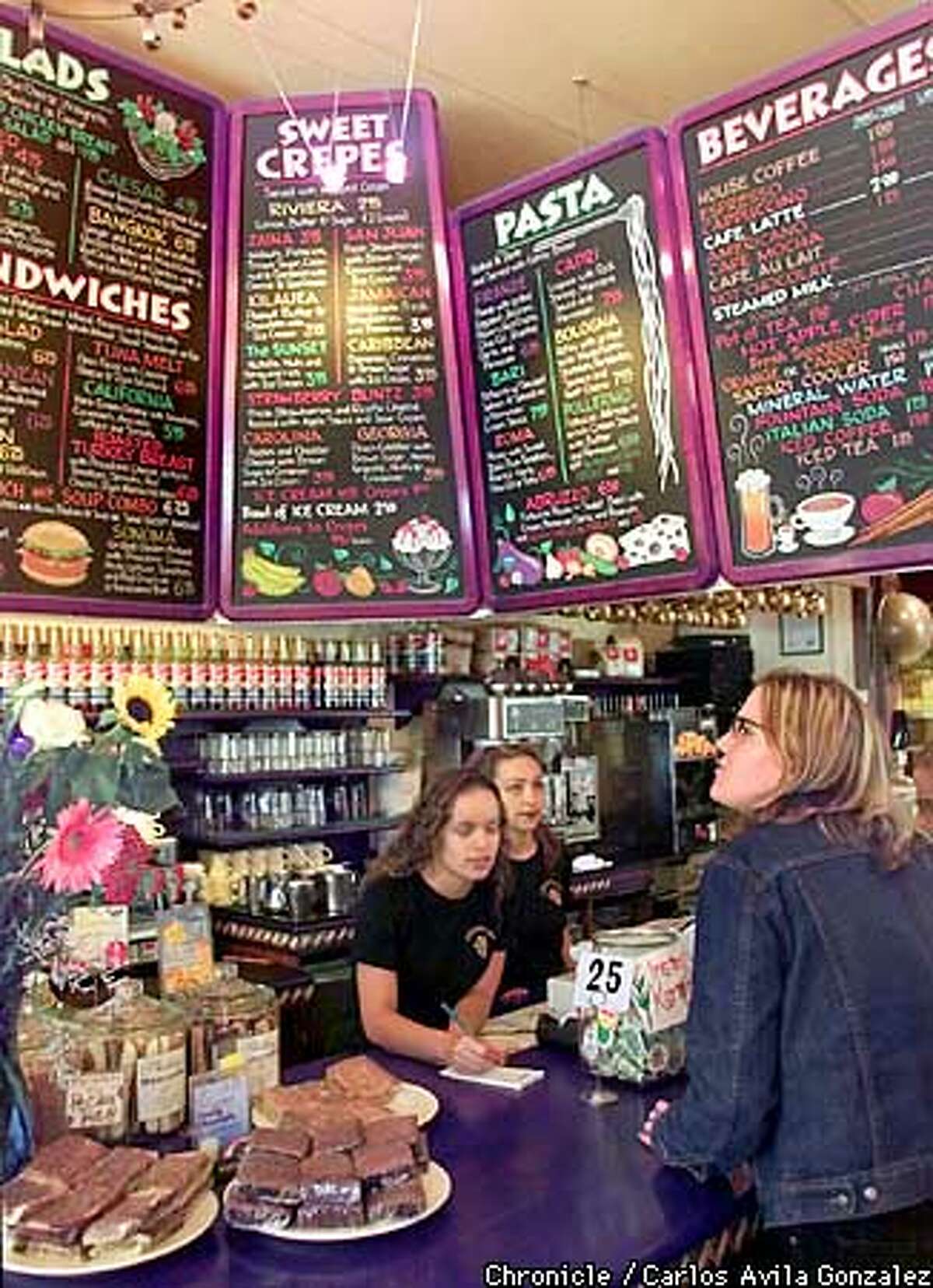 Wait staff at Crepevine in San Francisco, Ca., help customers on Wednesday, September 5, 2001. (Photo by Carlos Avila Gonzalez/The San Francisco Chronicle)