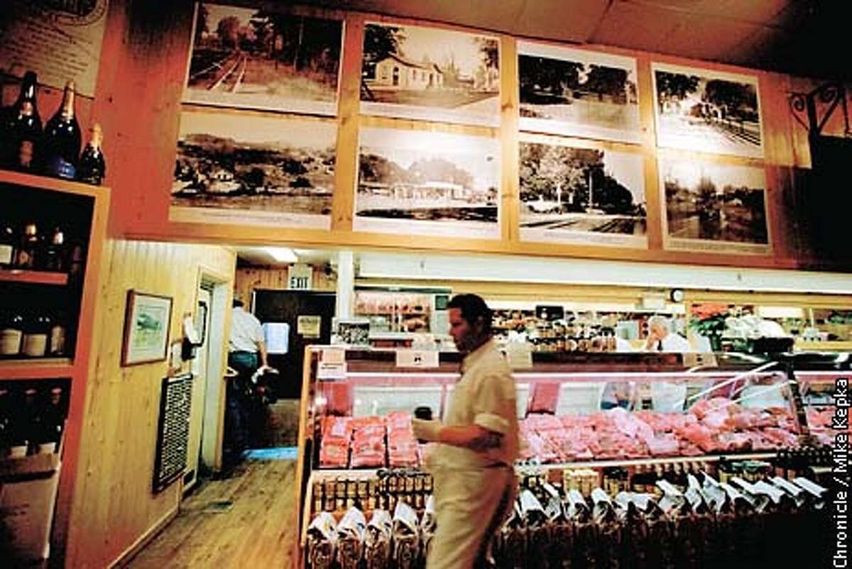 Historic photos of Kentfield in its early days hang above the meat market in Woodlands Market.