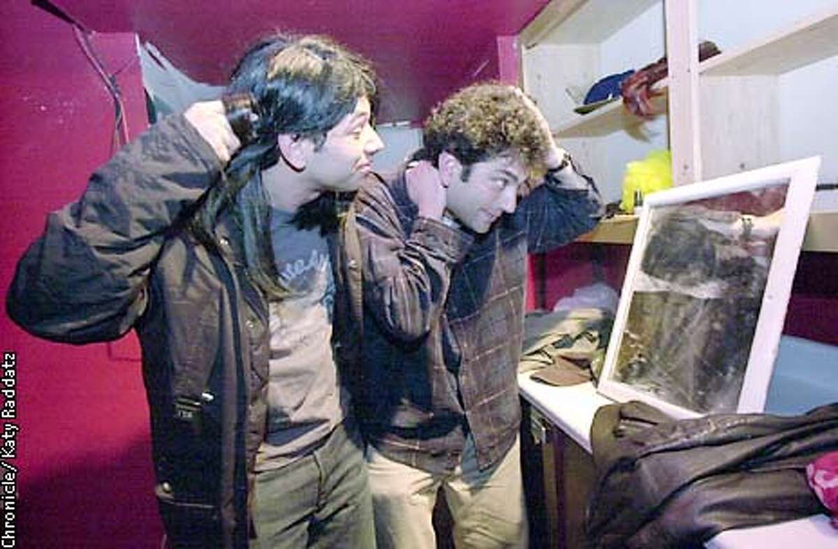Photo by Katy Raddatz--The Chronicle Local comedy groups get together for a 3 week festival at the Shelton Theater 533 Sutter St. SF. SHOWN: guys looking in mirror are The Fresh Robots Al Madrigal (L) and Mike Spiegelman (R). They're putting final touches on their wigs.