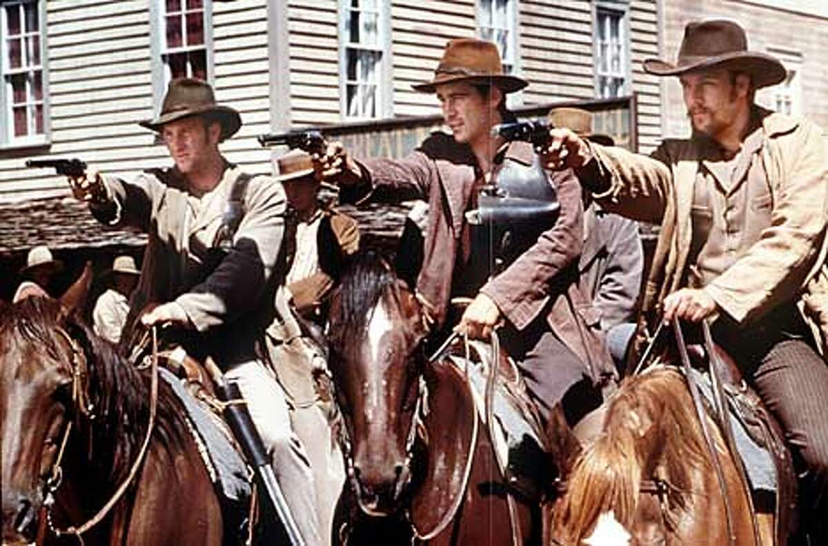 AMERICAN17-C-15QUG01-DD-HO (l to r) Scott Caan, Gregory Smith, Colin Farrell and Gabriel Macht in Morgan Creek's action adventure "American Outlaws," distributed by warner Bros. Pictures.