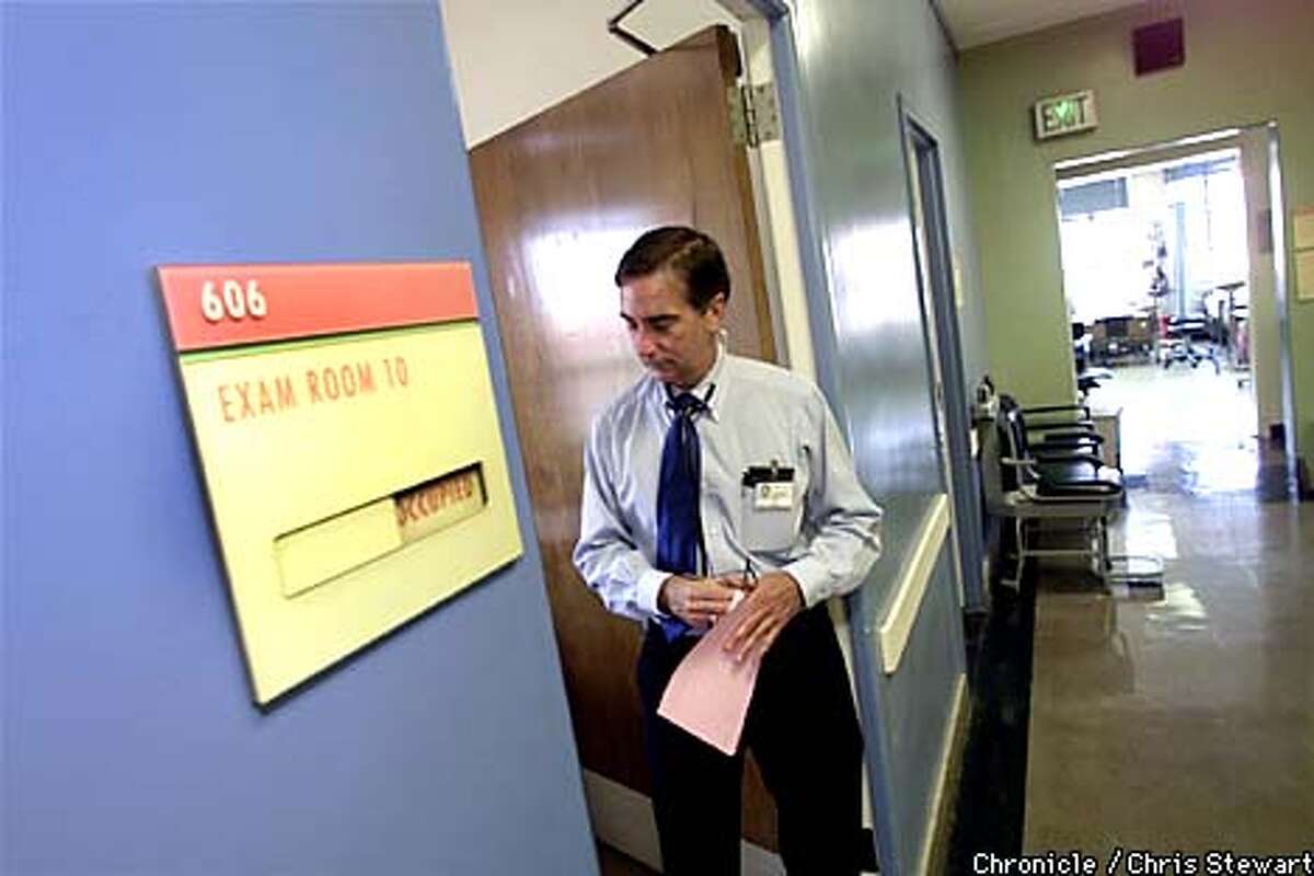 Dr. Donald Abrams pauses after examining a patient. Dr. Abrams is an AIDS/Marijuana researcher at SF General Hospital. He examines outpatient Lou Grosso, 47. SAN FRANCISCO CHRONICLE BY CHRIS STEWART