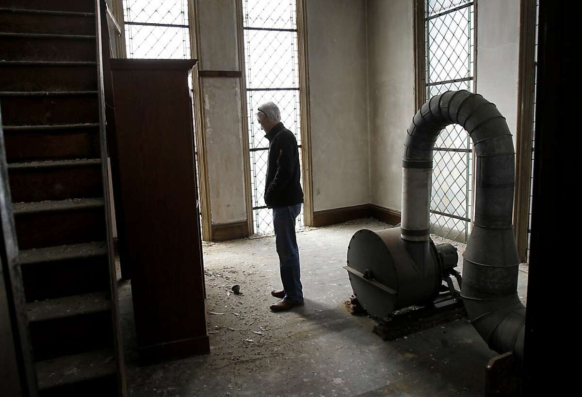 Developer Brian Spiers stops to look at the skeleton of a pigeon in a back room. The church was full of pigeons and the homeless at one point. St. Joseph's Church, a historic landmark built in 1913 in San Francisco, Calif., has been vacant since the earthquake of 1989. Now a developer wants to reopen the church, after completing seismic upgrades, as office and retail space.
