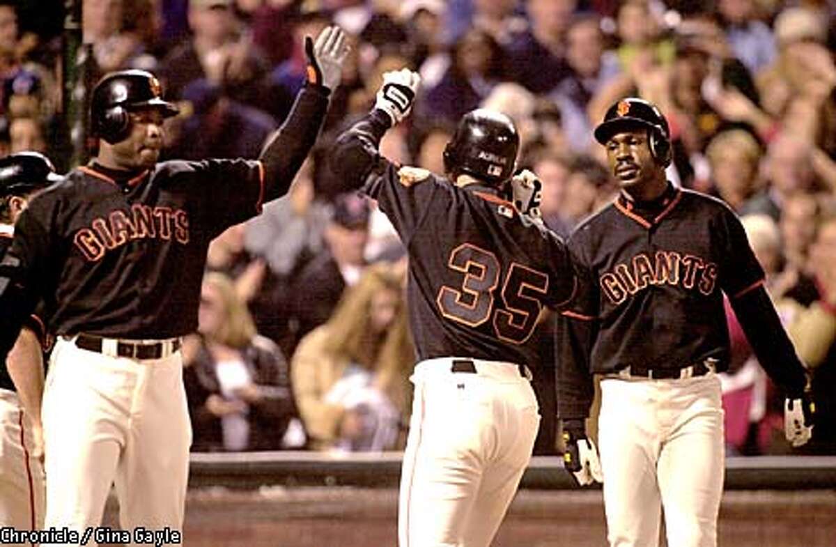 Philadelphia Phillies' Bobby Abreu, center, is congratulated by