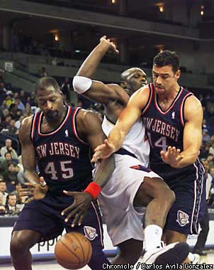 Mookie Blaylock of the New Jersey Nets dribbles up court during a