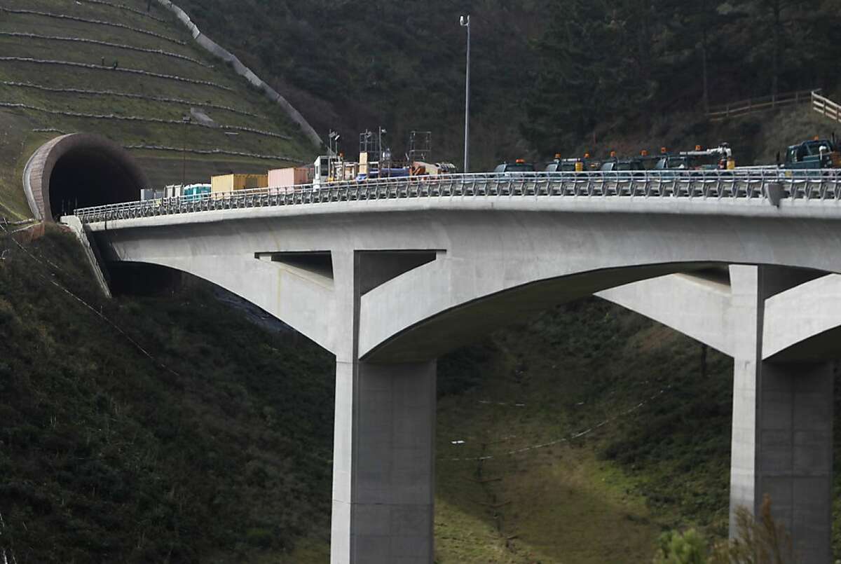 Construction vehicles are parked on the bridge leading from the northbound Devil's Slide tunnel project in Pacifica, Calif. on Tuesday, Jan. 31, 2012. Caltrans is hoping to open the two bores to traffic by the end of the year.