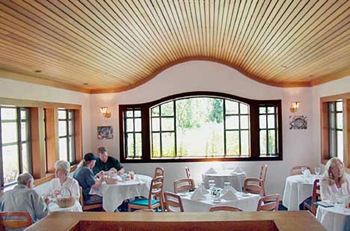 The wavy, slatted red cedar ceiling at Mudd's Restaurant in San Ramon is distinctive and good for absorbing noise, and no table is more than six feet from a window.