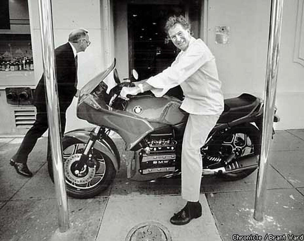 Jeremiah Tower and on his motorcycle celebrating a legal victory in 1988. Chronicle Photo by Brant Ward