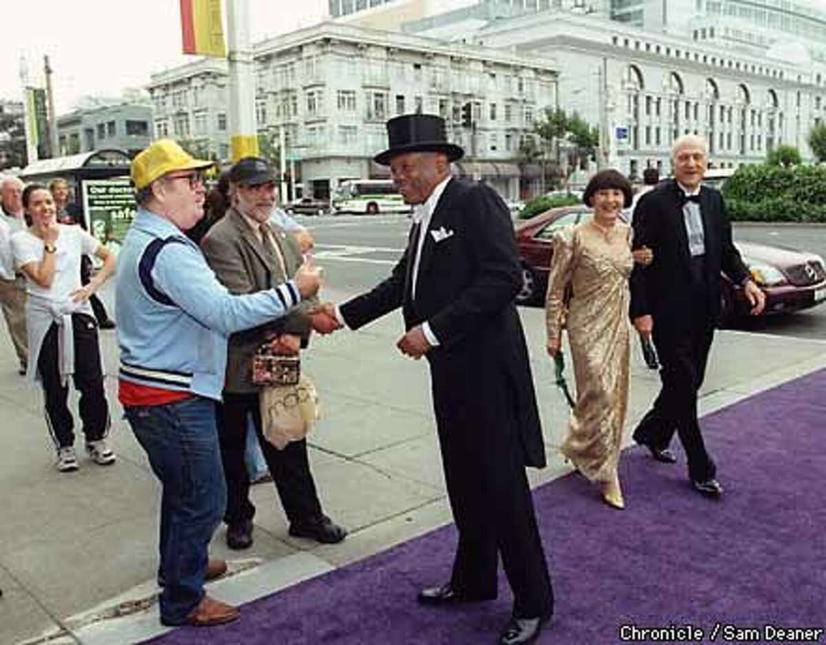 WILLIE-11SEP99-MN-SD--As Willie Brown was walking to the Opera House in his opening night finery, he shakes the hands of some of his constituents along Van Ness Avenue. By Sam Deaner/Chronicle