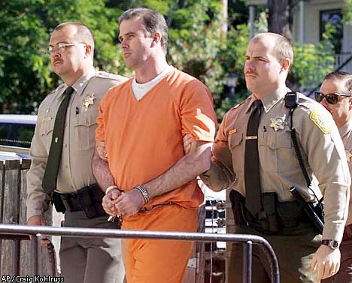 Cary Stayner, center, is led into the Mariposa Courthouse by Mariposa County Sheriff Sgt. Rich Parrish, left, and jail officer Sean Land on Monday, June 11, 2001. (AP Photo/The Fresno Bee, Craig Kohlruss)