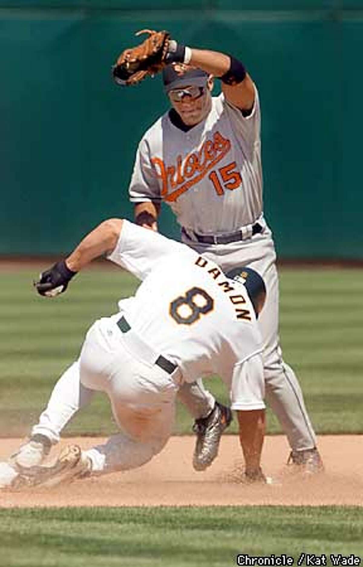 With the Oriole's Jerry Hairston, close behind, Atheletic's player Johnny Damon stole second base during the 7th inning during the game against the Baltimore Orioles at Network Associates Coliseum June 4, 2001. SAN FRANCISCO CHRONICLE PHOTO BY KAT WADE