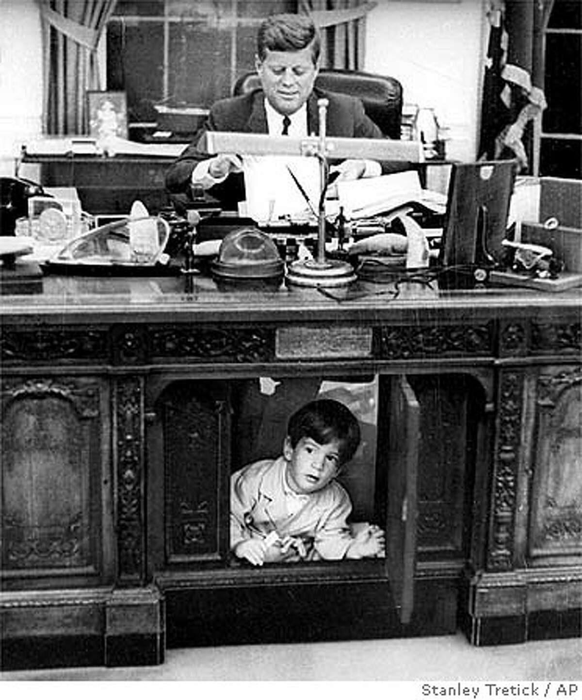 COMMENTARY / Pictures Of a Desk And a Salute / Two photos of JFK Jr ...