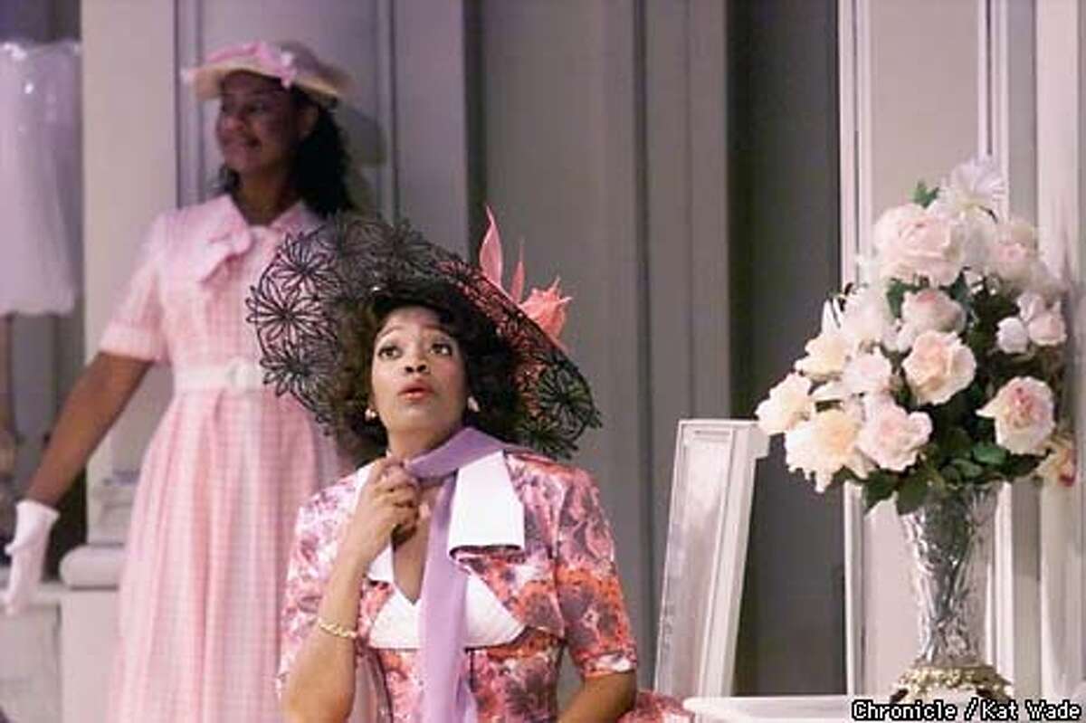 Shona Tucker, plays the part of Elmire, Orgon's wife, during the opening act of the preview performance of Tartuffe, ACT's African-American version of the Moliere farce set in 1950's Durham, North Carolina. In the background is Nicole E. Lewis, as Flipote. SAN FRANCISCO CHRONICLE PHOTO BY KAT WADE