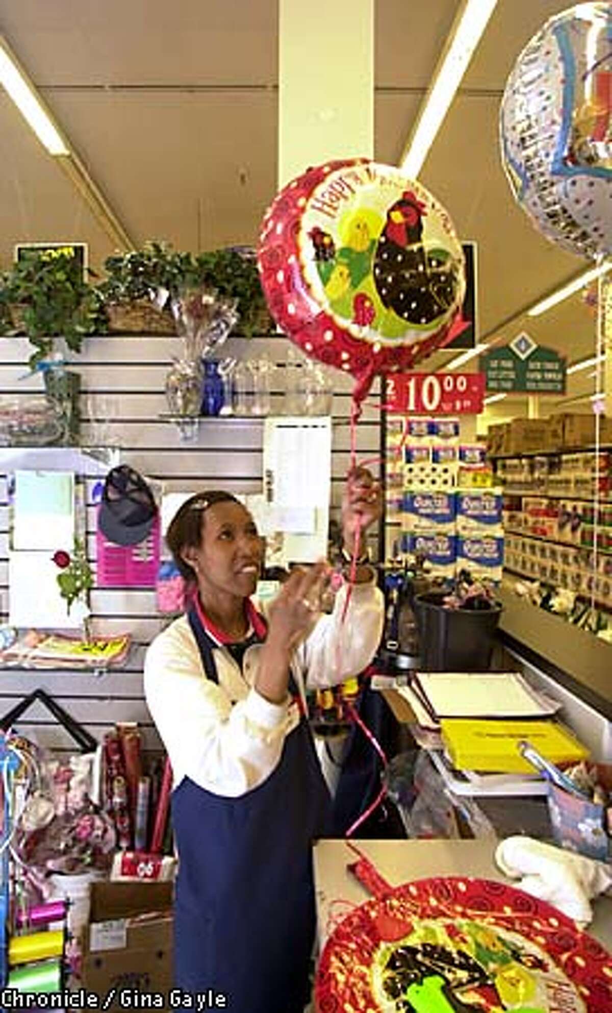 Sonia Jackson finished work on a Mother's Day balloon at a Hayward Safeway store. Chronicle photo by Gina Gayle