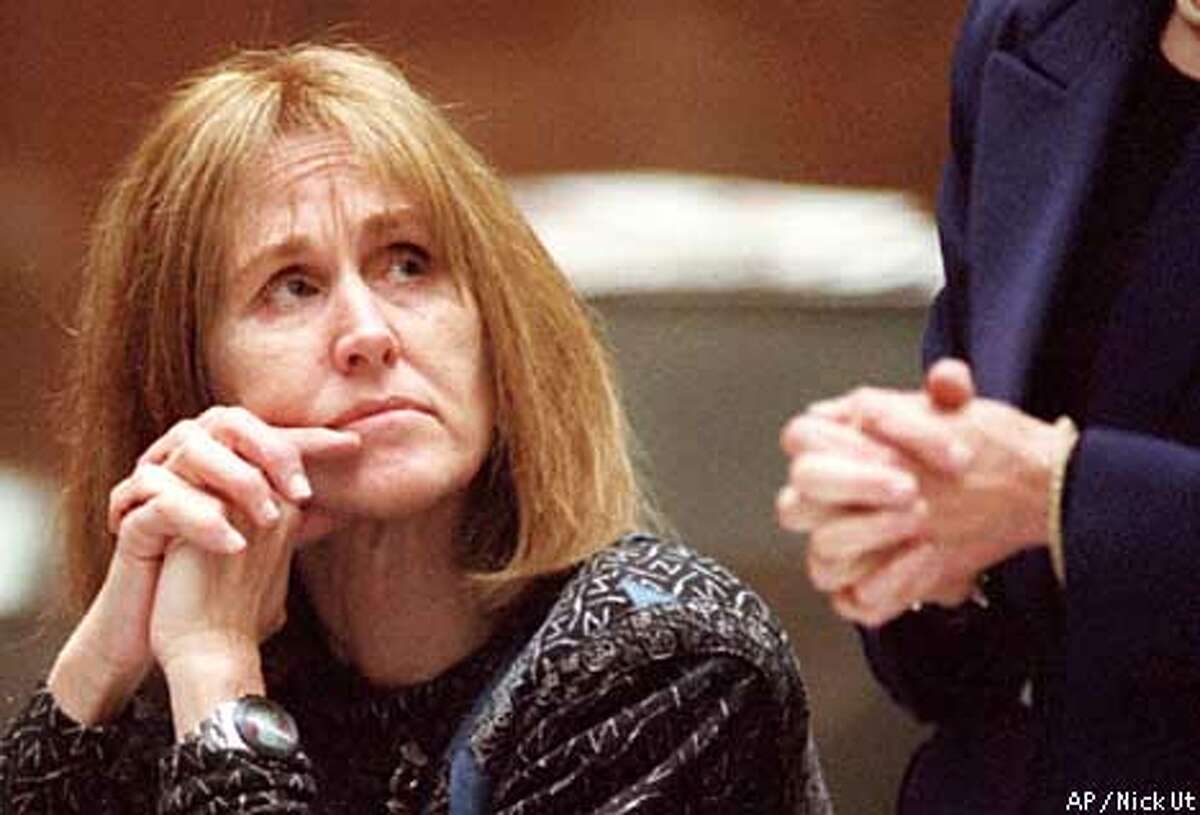 Former Symbionese Liberation Army fugitive Sara Jane Olson looks to her attorney Susan Jordan as Jordan addresses a Los Angeles court Tuesday Jan. 18, 2000, where a defense motion to postpone the start of the bombing conspiracy trial was heard. Defense co-counsel Stuart Hanlon, of San Francisco, asked to withdraw from the case due to family problems. The judge agreed to both requests. (AP Photo/Nick Ut) ALSO RAN 11/2/2000, 11/15/2000 ALSO RAN 12/12/00.