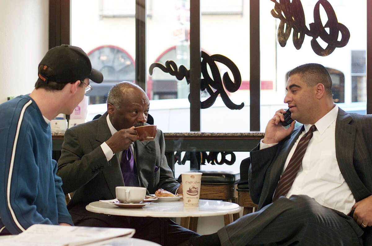 Former mayor Willie Brown relaxes and sips on a mocha at Caffe Roma in the North Beach area after casting his vote in chinatown. He sits with former press secretary PJ Johnston (left) and Fred Hamdun (right), Brown's campaign manager. 