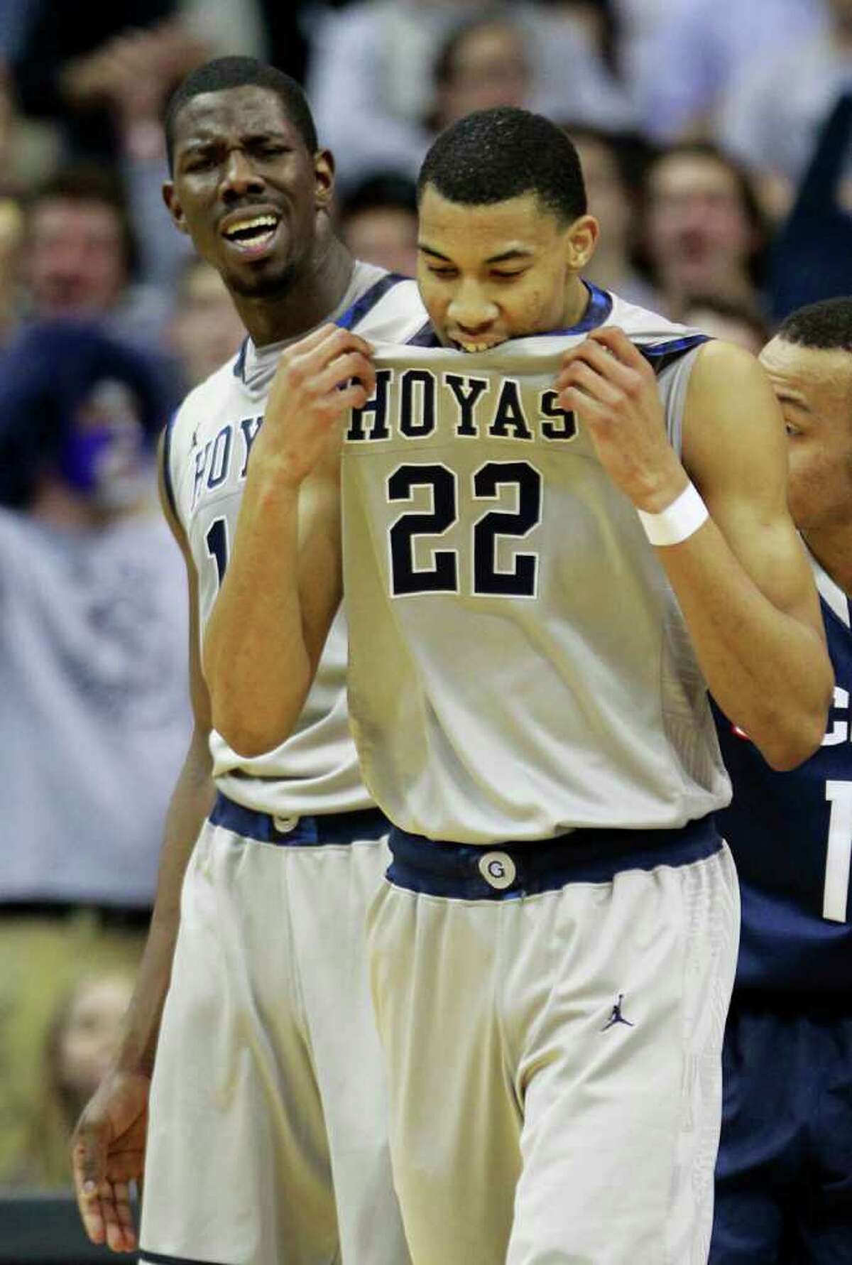 Georgetown's Otto Porter (22) and Henry Sims, rear, react to a play during the first half of an NCAA college basketball game against Connecticut, Wednesday, Feb. 1, 2012, in Washington. (AP Photo/Haraz Ghanbari)