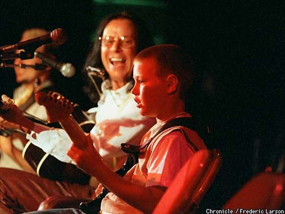 CONCERT22-1/C/20MAY99/MN/FRL: Chris Capone (10) of St Isidore Elementary in Danville plays along with professional guitarist Bruce Hock during a recital at Monte Vista H.S. in honor of Chester Farrow who is retiring after 32 years of teaching. Chronicle photo by Frederic Larson
