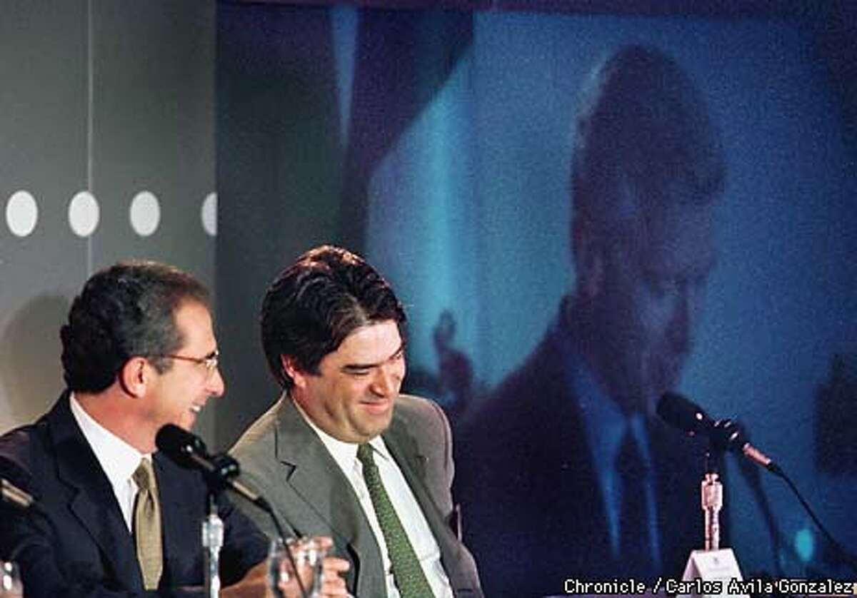 Mexican President Ernesto Zedillo and Mextel's Jaime Pardo, share a laugh following a joke by Governor Gray Davis (on screen in rear), during a presentation by executives of the Mexican telecomminications company where they announced further business dealings with the State of California on Thursday, May 20, 1999. Davis is largely responsible for reestablishing business ties with Mexico following years of silence on the business front from Governor Pete Wilson. (CARLOSAVILA GONZALEZ/SAN FRANCISCO CHRONICLE)