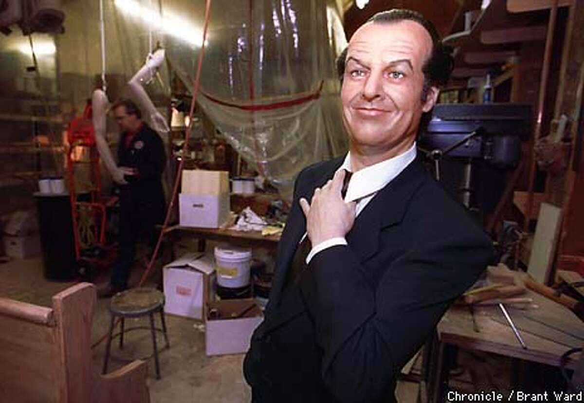 WAX1/13MAY99/MN/BW--Wax Museum curator Curtis Huber, in background, works in a cramped storage area while construction continues on the museums' new home. One of Ron Fong's newest creations, Jack Nicholson, is one of the few wax figures not in boxes. By Brant Ward/Chronicle
