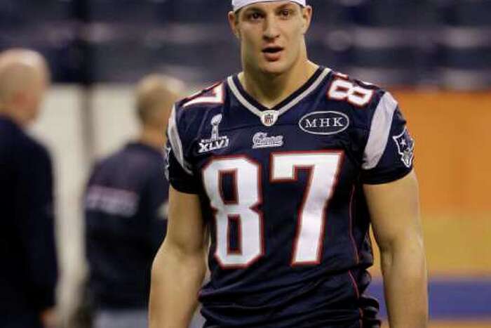 New England Patriots tight end Ron Gronkowski arrives on the field for  media day prior to Super Bowl XLVI in Indianapolis on January 31, 2012.  This is Gronkowski's first day without wearing