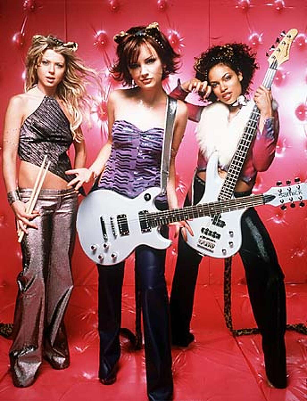 Tara Reid, Rachael Leigh Cook and Rosario Dawson (from left) in "Josie and the Pussycats." Handout Photo