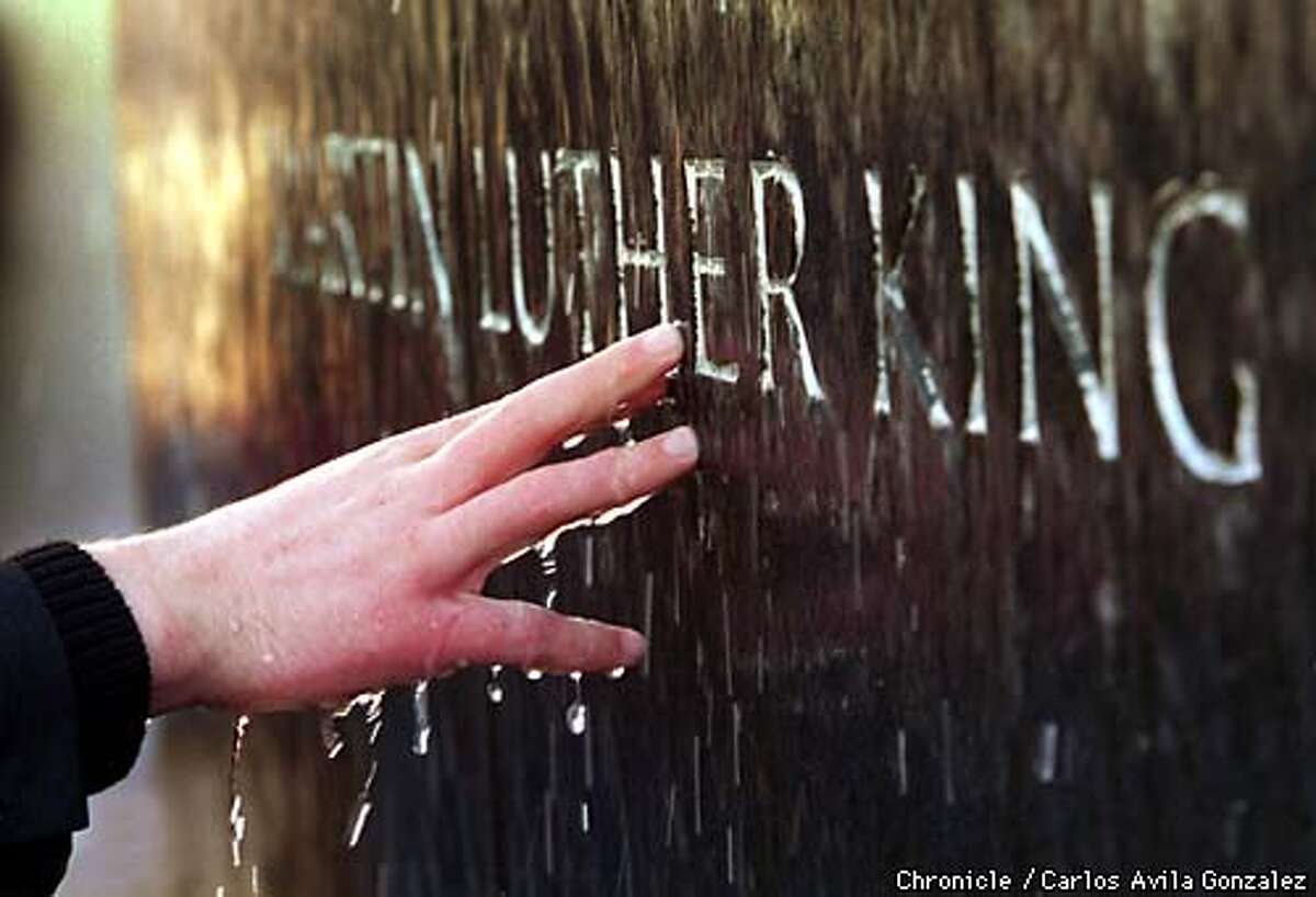 At the Civil Rights Memorial, a student from Capuchino High School, touches the carved name of the Rev. Dr. Martin Luther King, Jr. BY CARLOS GONZALEZ/THE CHRONICLE