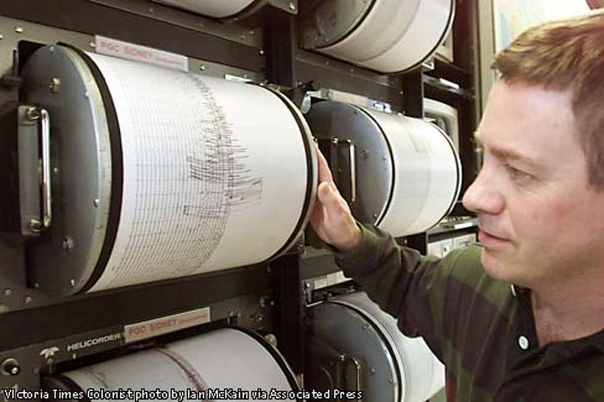 Seismologist John Cassidy reads the seismograph chart at the Pacific Geoscience Center of the Pacific from the earthquake that shook Victoria on Wednesday morning Feb. 28, 2001. The epicenter was southwest of Seattle in Washington State with a magnitude of 6.8. (AP Photo/VIctoria Times Colonist, Ian McKain)